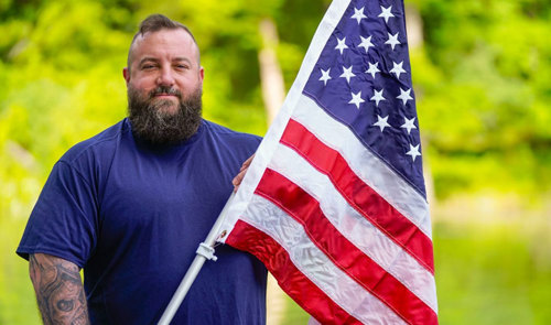 Wounded Warrior Matthew Templeton With Flag