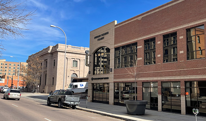 Exterior of the Wounded Warrior Project office in Colorado Springs, Colorado, featuring the WWP logo on the building. 