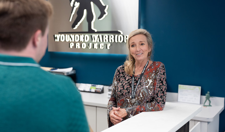 WWP teammates talking at desk.