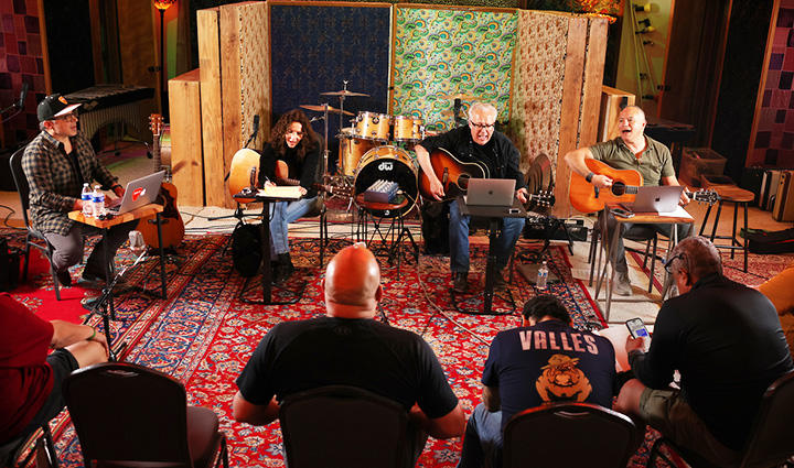 Veterans sit in a small circle listening to live music during a SongwritingWith:Soldiers workshop in El Paso, Texas.